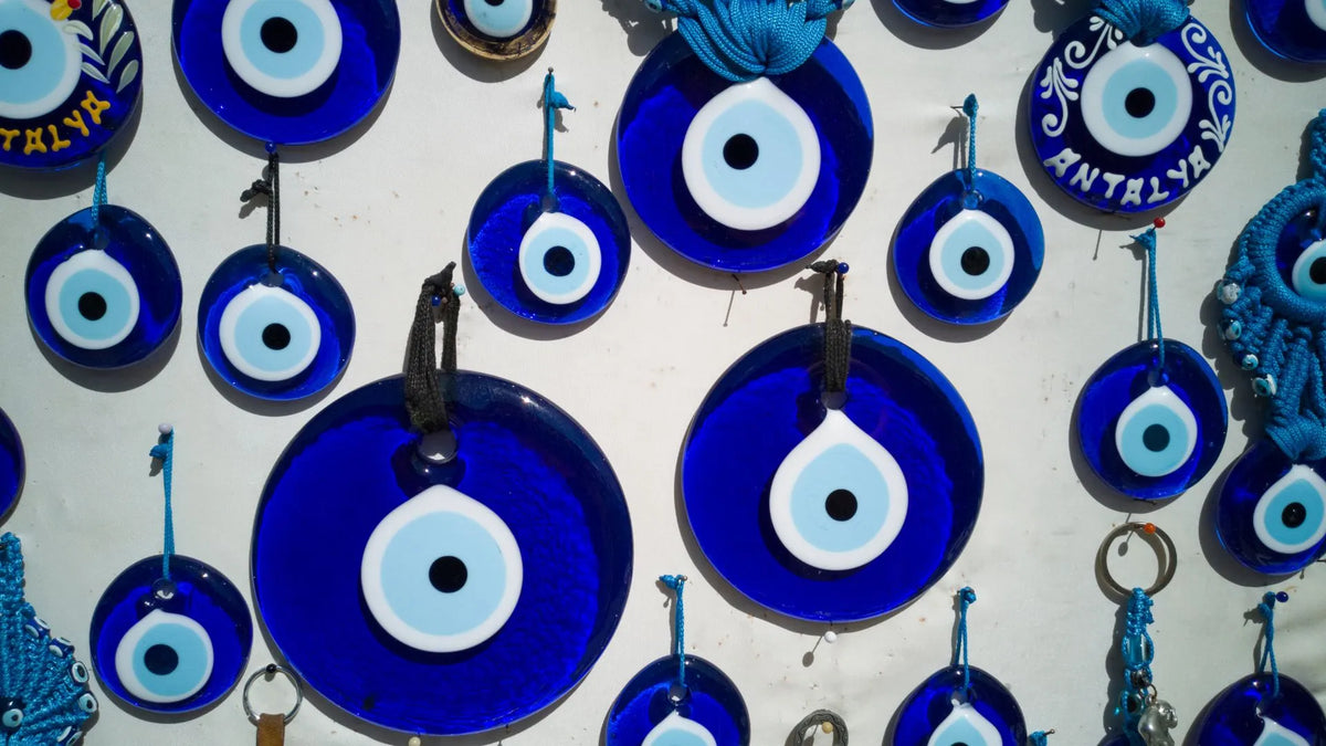 A person wearing a protective amulet to ward off the evil eye, symbolizing personal and family safety.