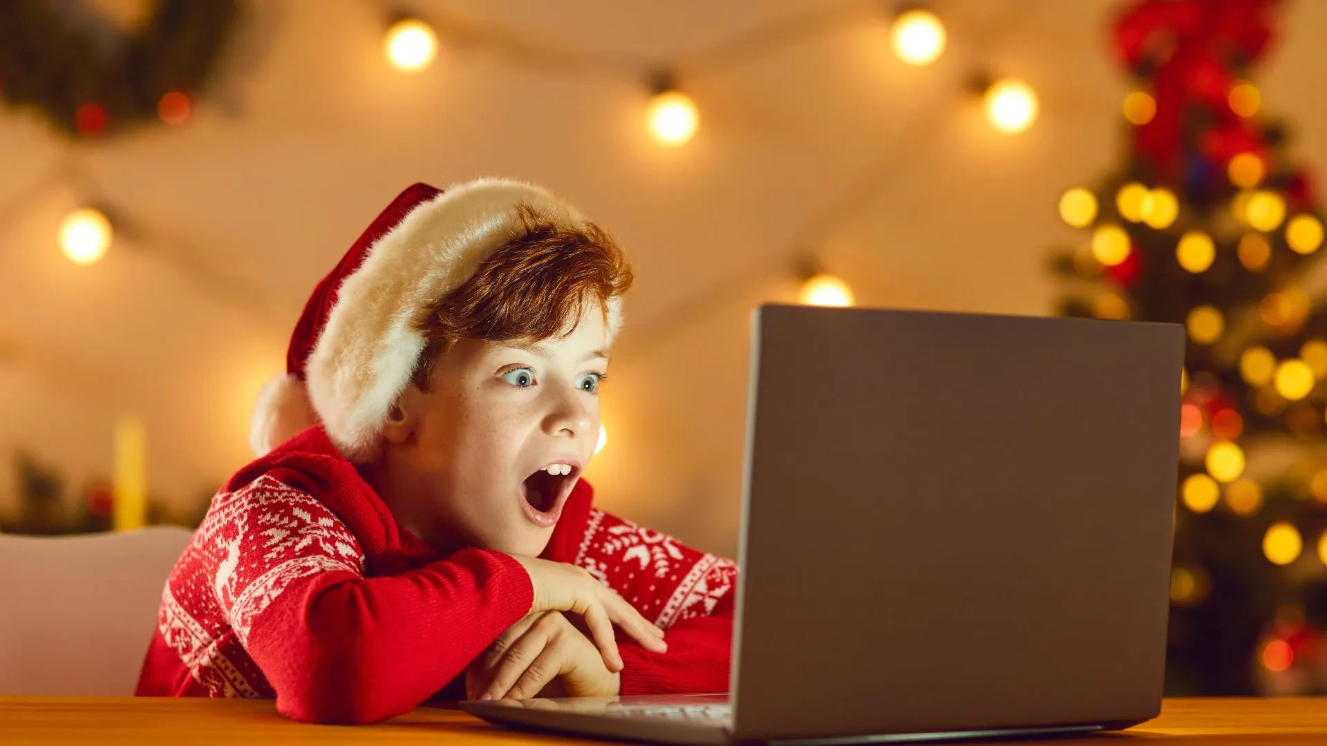 A group of friends enjoying an online Secret Santa gift exchange during the holiday season.