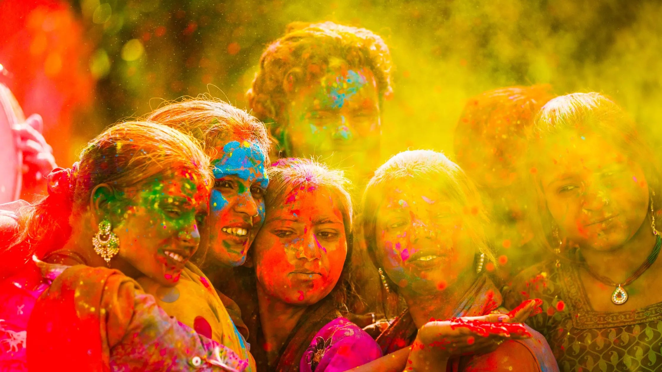 Vibrant powders of Holi colors displayed in bowls, showcasing the traditional process of color making for the festival.