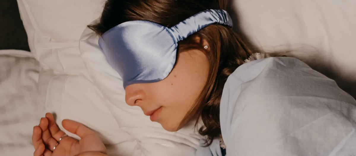 A person struggling to sleep, showcasing common symptoms of sleeping disorders like insomnia and restlessness.