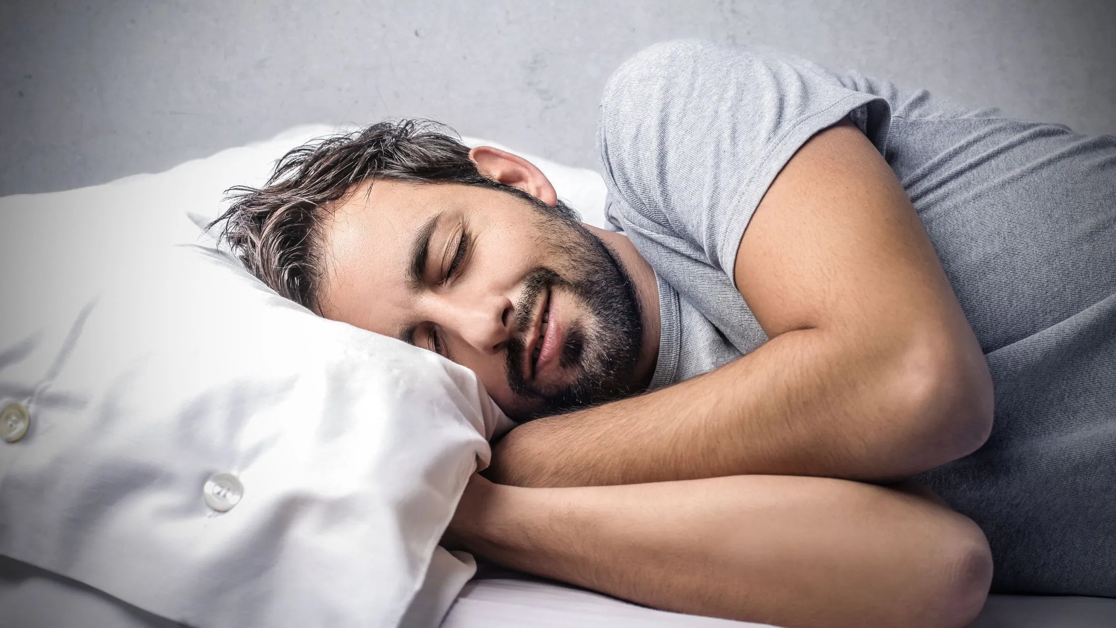 A person looking stressed and tired, highlighting symptoms of stress and insomnia.